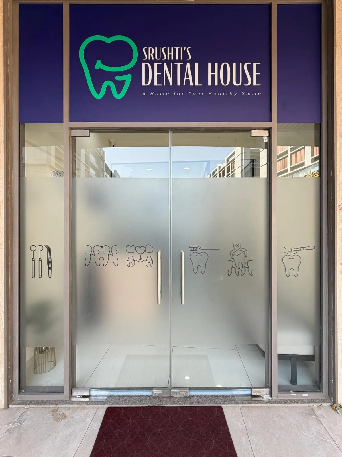 The entrance to Srushti's Dental House at The Landmark, B1-107, Kudasan